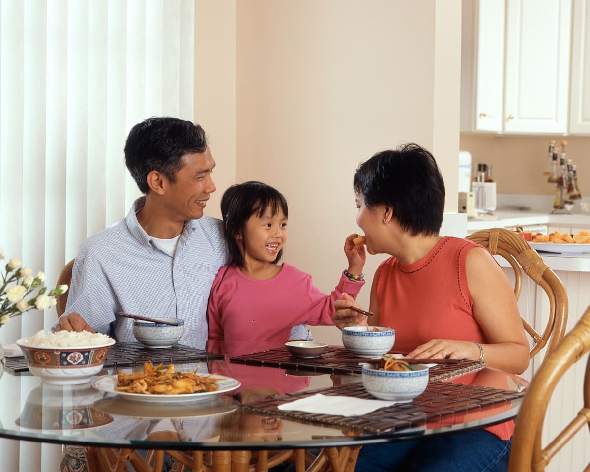 A family sharing dinner together at home